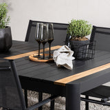 Togo - Jídelní stůl - Černá / Teak - Allu / Teak - 150*100 _1+ křeslo Santorini (stohovatelné) - Černá alu / Černá textilie _4